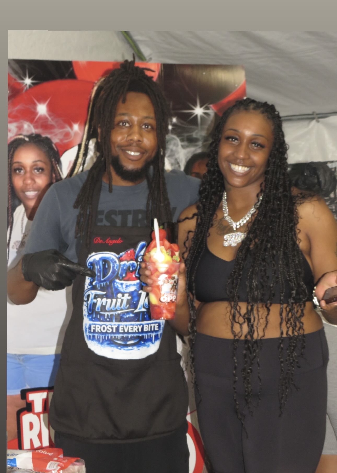 Drip Fruit Ice team serving a loaded fruit ice cup at a Chicago event